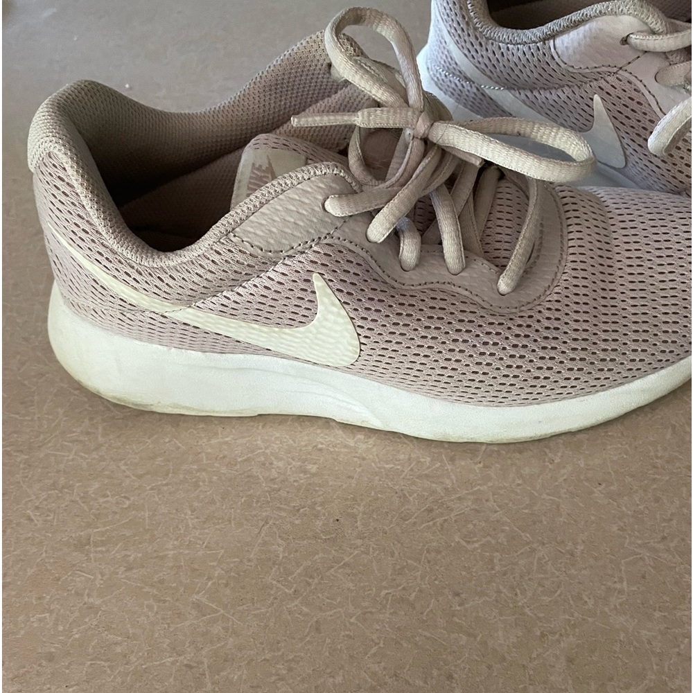 Nike women’s Tajuan sneakers.